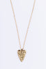 Gold chain necklace featuring a textured heart pendant on a white background.